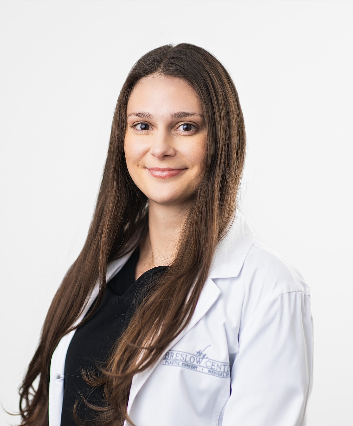 Smiling professional in a medical lab coat.