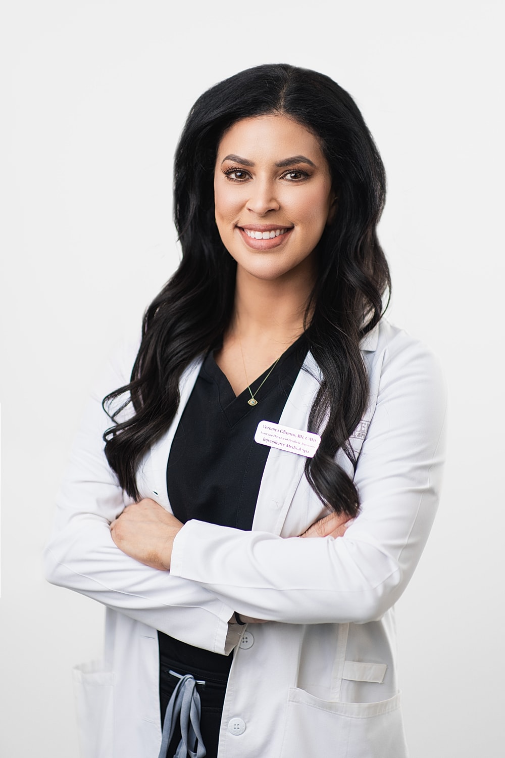 Smiling healthcare professional in a lab coat.