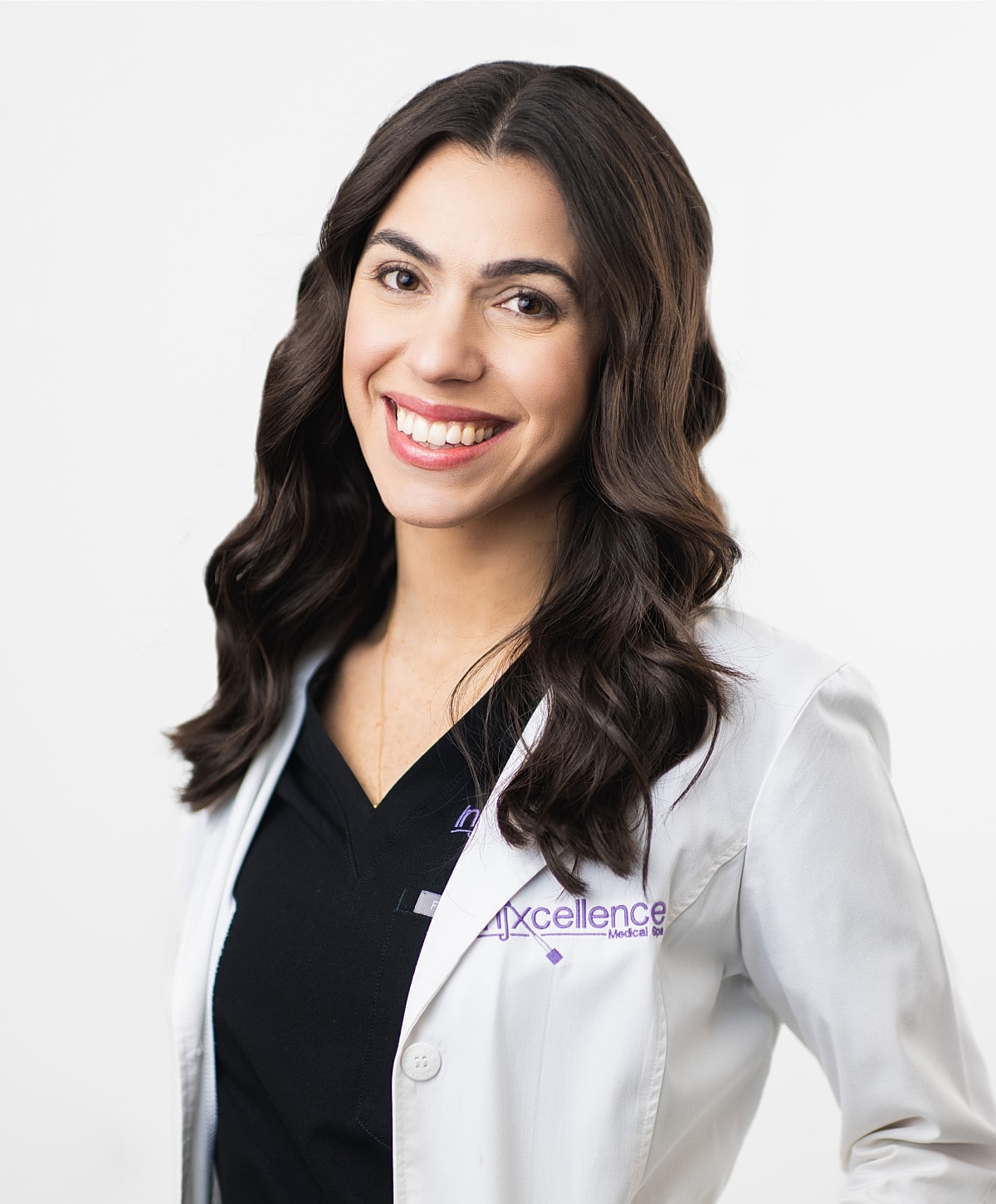 Smiling professional in medical attire, white background.
