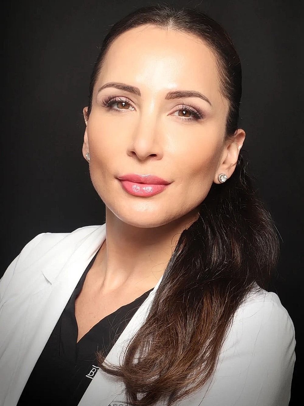 Medical professional in a white coat portrait.