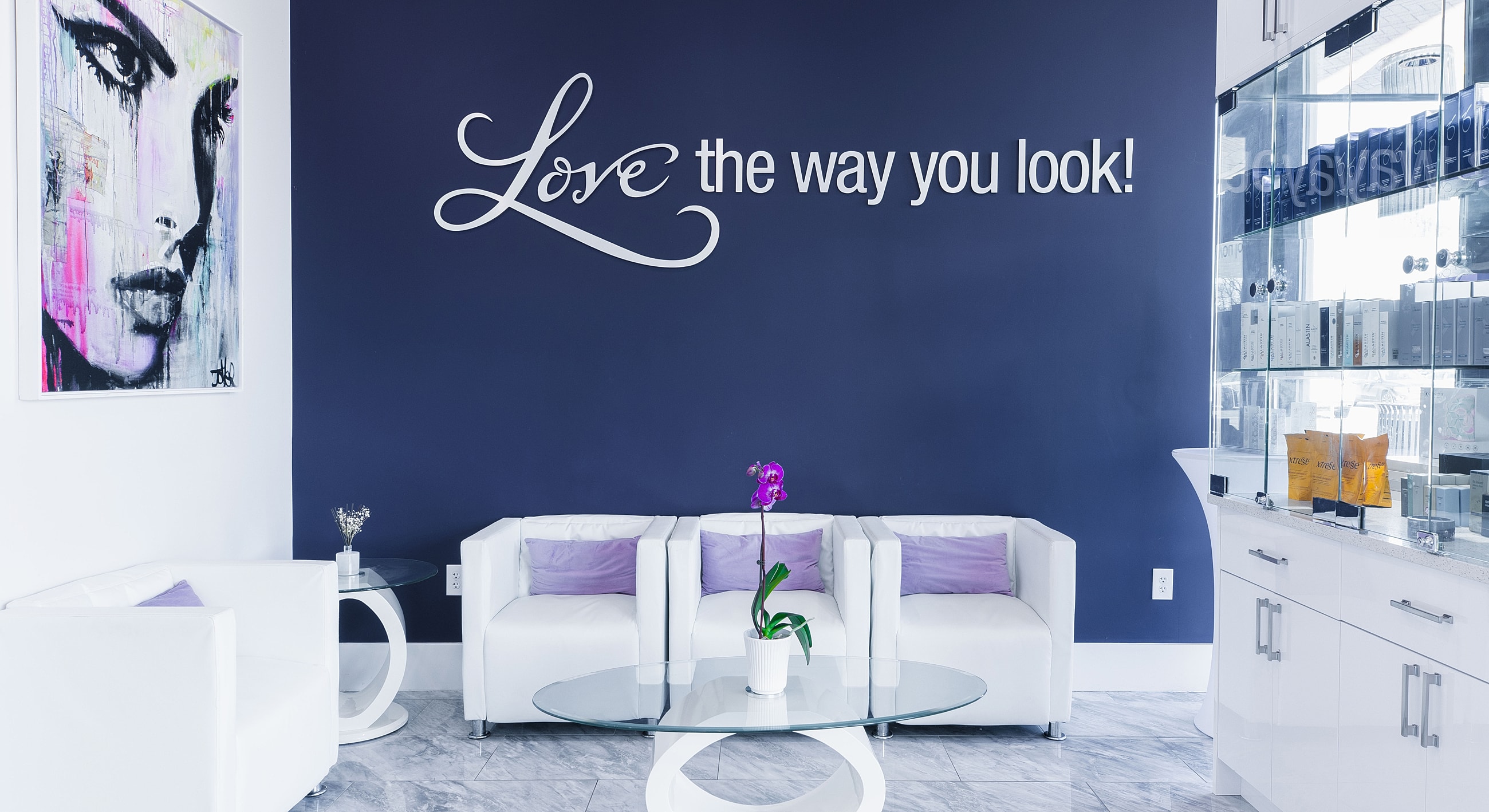 Modern beauty salon interior with motivational decor.