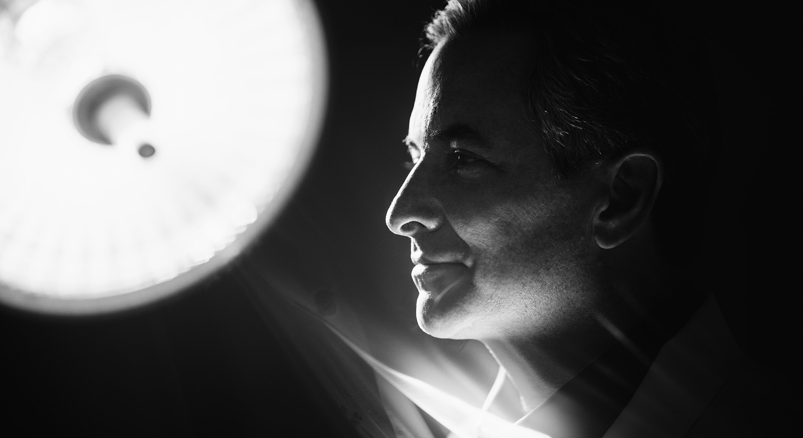 Medical professional in dramatic lighting portrait.