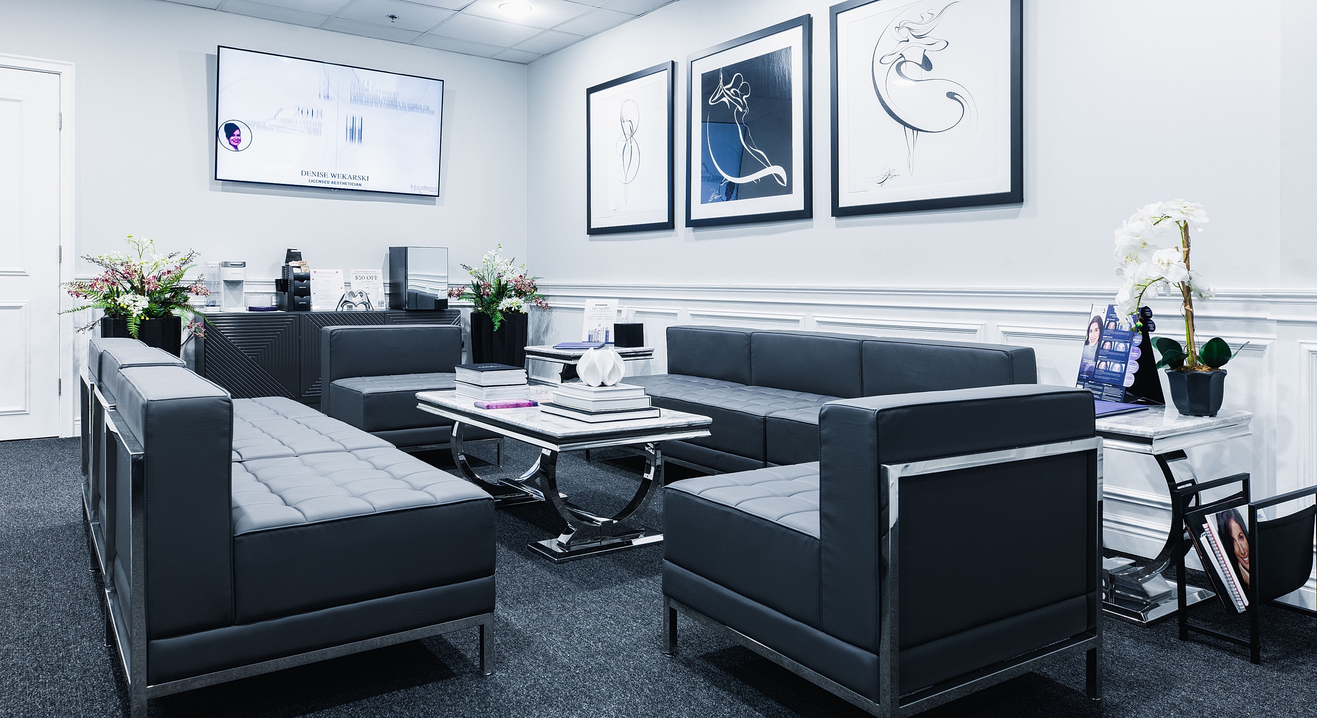 Modern waiting room with stylish furniture and decor.