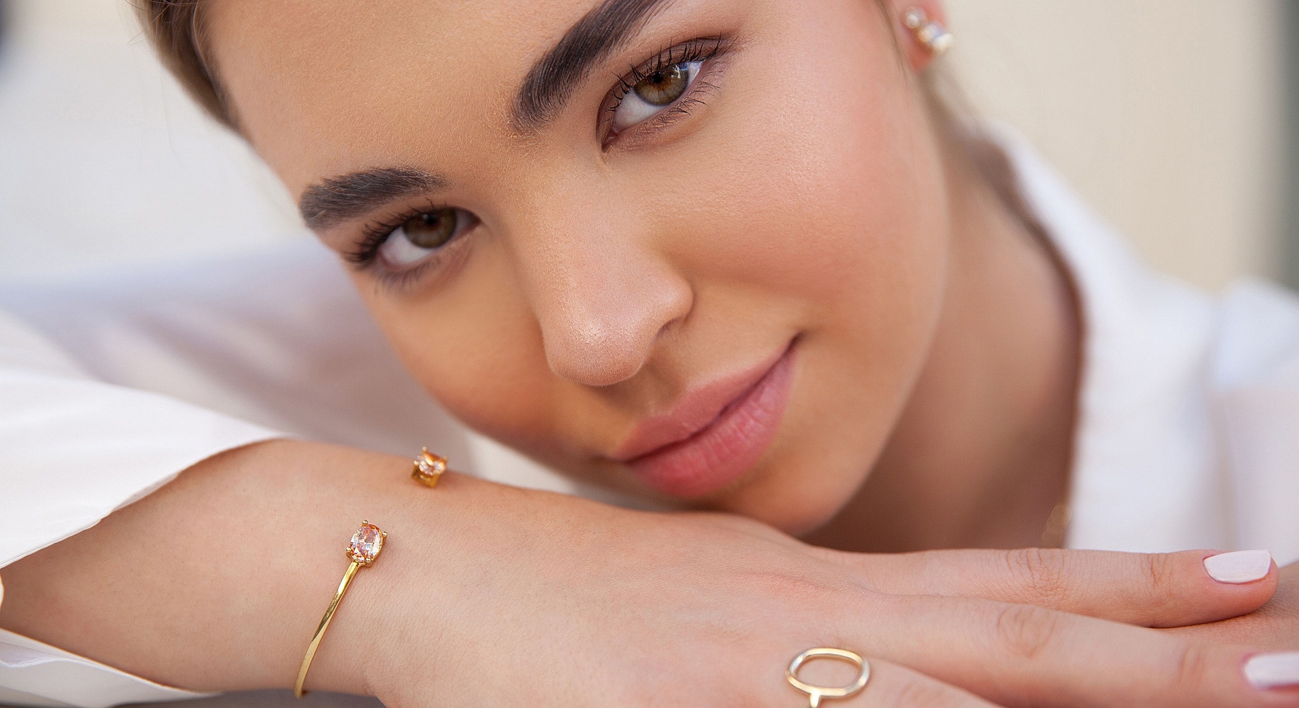 Close-up of woman wearing elegant jewelry.